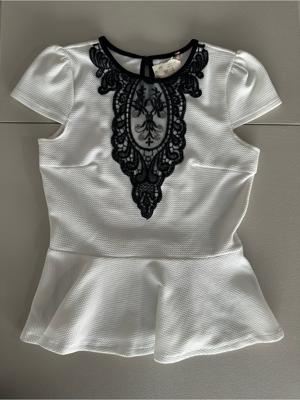 Flamingo brand Women's White Peplum Top with Black Lace Applique